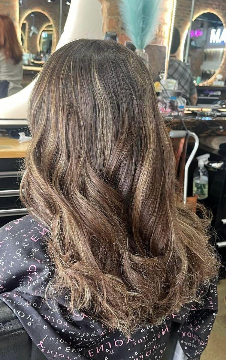 Long brunette hair with soft dimensional color by Pandee